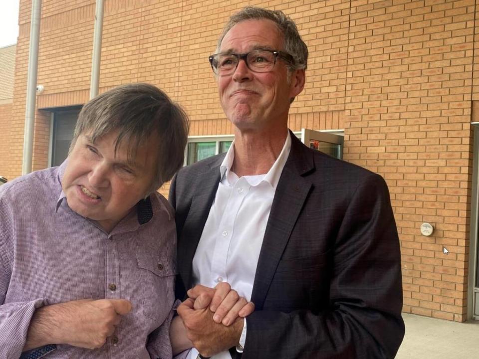 Darryl Boguski, left, is one of five former Saskatchewan care home residents allegedly sexually assaulted by worker Brent Gabona. Boguski and his brother, Rick, successfully applied to the court Tuesday to have the publication ban on Darryl's name lifted so they could speak out. (Jason Warick/CBC - image credit)