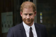 FILE - Prince Harry leaves the High Court after giving evidence in London, on June 6, 2023. Prince Harry won his phone hacking lawsuit Friday Dec. 15, 2023 against the publisher of the Daily Mirror and was awarded over 140,000 pounds ($180,000) in the first of his several lawsuits against the tabloids to go to trial. (AP Photo/Alberto Pezzali, File)