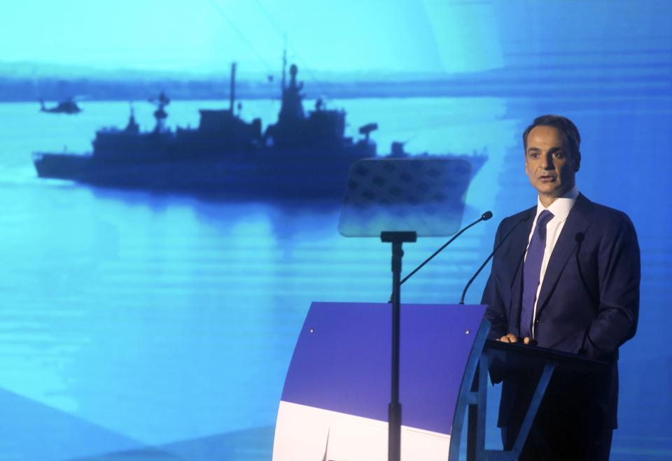 Greece's Prime Minister Kyriakos Mitsotakis delivers an annual state of the economy speech in the northern city of Thessaloniki, Greece, Saturday, Sept. 12, 2020. Mitsotakis outlined plans Saturday to upgrade the country's defense capabilities, including purchases of new fighter planes, frigates, helicopters and weapons systems, amid heightened tensions with neighboring Turkey over rights to resources in the eastern Mediterranean. (Giannis Moisiadis/InTime News via AP)