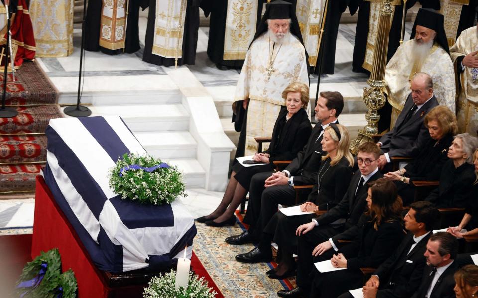 Greece's former queen Anne Marie, former crown prince Pavlos, Princess Marie-Chantal and guests sit next to the coffin during the funeral service of former king of Greece Constantine II - AFP