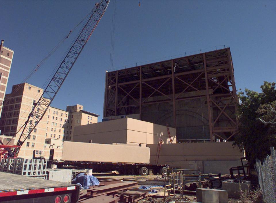 Large panels stand waiting to be lifted up for installation as exterior walls on the Morris Civic Auditorium expansion on Sept. 23, 1999. Workers hope to have the structure enclosed by winter.