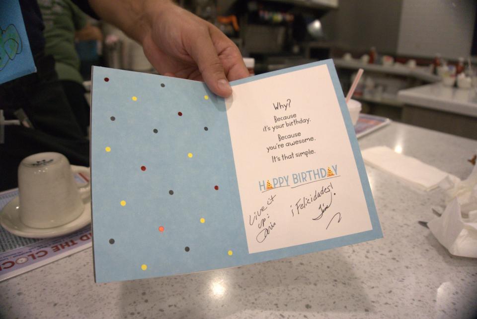 Doris Henry and Tim Enders, regulars and friends for 30 years, hand their longtime server Kellum Dietz a blue envelope, just before getting up, unaware of the celebration that was about to unfold.