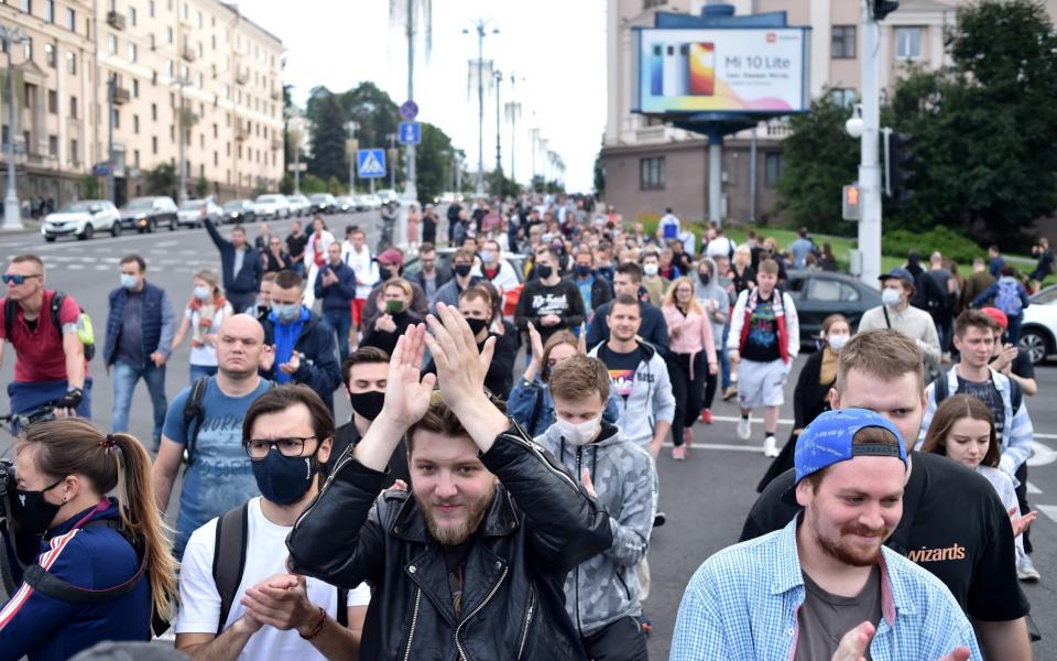 Protesters marched through central Minsk on Tuesday before violent detentions began - Sergei Gapon/AFP