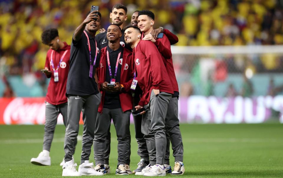 Qatar players pose for photos on the pitch prior to the FIFA World Cup Qatar 2022 Group A match between Qatar and Ecuador at Al Bayt Stadium on November 20, 2022 in Al Khor, Qatar - Getty Images/Michael Steele