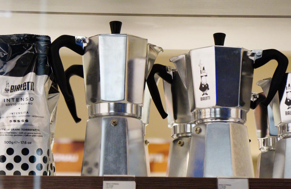 Models of Italy's iconic stove-top Moka coffee maker, Bialetti, are pictured in a store in Rome on October 31, 2018 as the brand has sought protection from creditors while it negotiates an injection of funds to shift to growth products including capsule systems. - The octagonal metal pot that sends steam up through ground coffee became a paragon of Italian design as well as the preferred method for generations of Italians to make their morning expresso. While an updated model remains popular, sales slumped 12 percent in the first half of the year due to shifts in the market and financial difficulties that led to supply problems.  Bialetti racked up a net loss of 15.3 million euros ($17.2 million). (Photo by Vincenzo PINTO / AFP)        (Photo credit should read VINCENZO PINTO/AFP via Getty Images)
