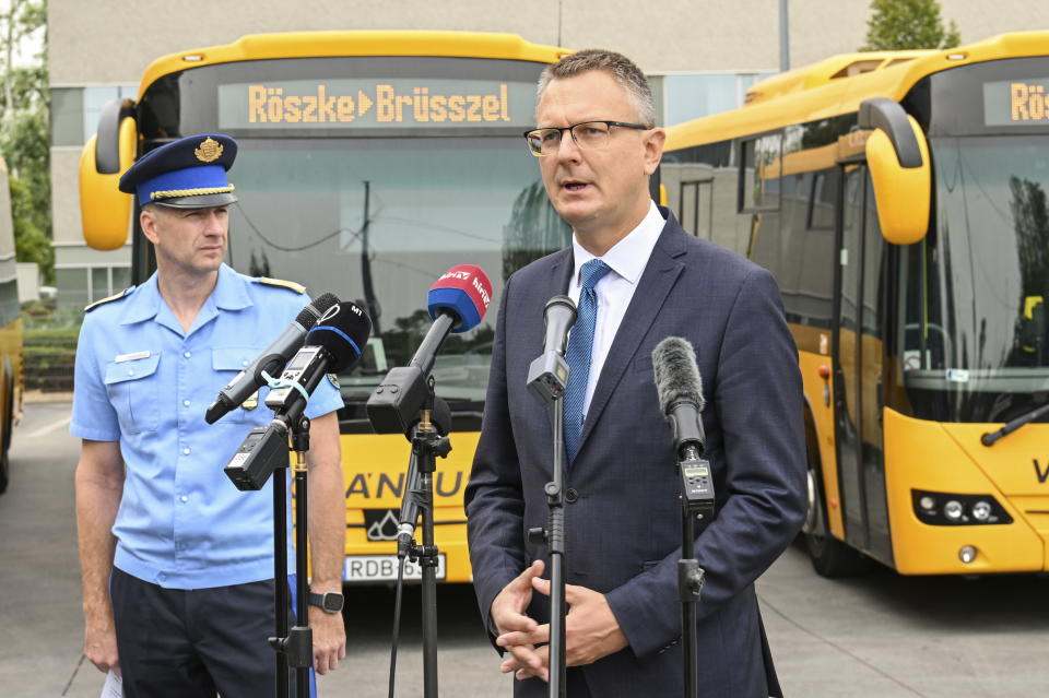 Hungary's State Secretary Bence Rétvári, right, and National Deputy Chief of Police Janos Kuczik hold a joint press conference at the bus station of Nepliget, Budapest, Hungary, Friday Sept. 6, 2024. (Tibor Illyes/MTI via AP)