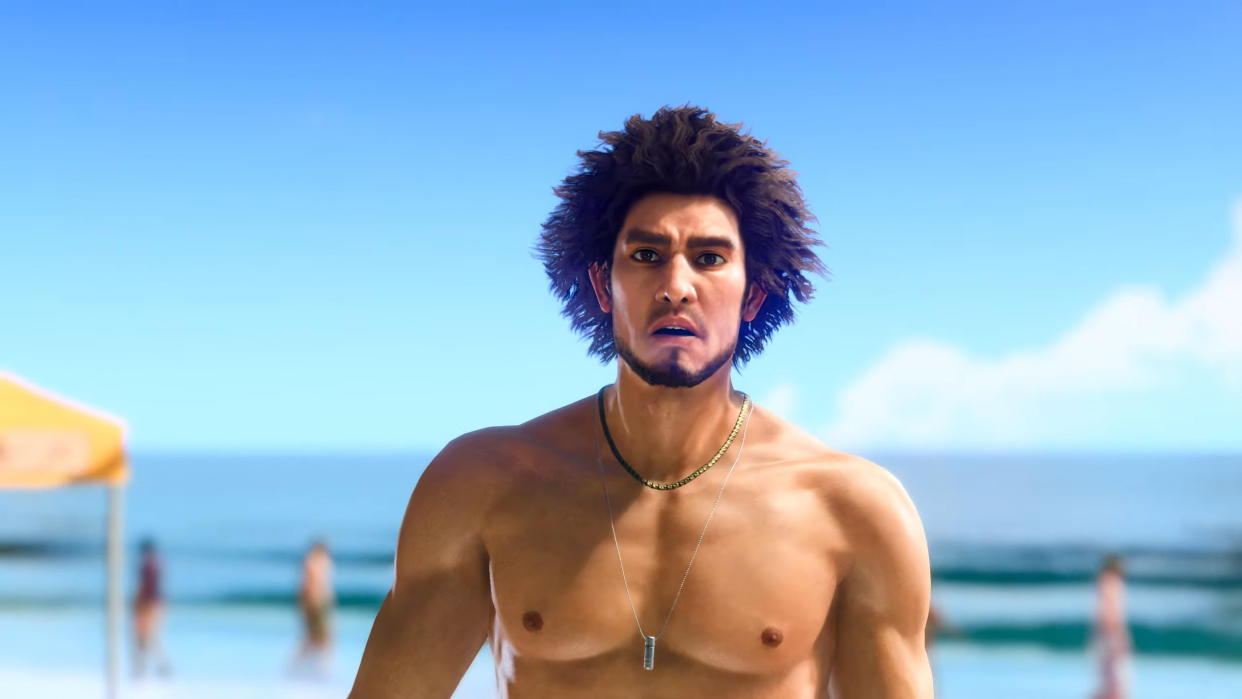  Ichiban stands shirtless on a sunny beach, with an exasperated expression. 