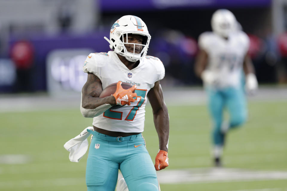 Miami Dolphins running back Kalen Ballage runs upfield during a 75-yard touchdown run in the second half of an NFL football game against the Minnesota Vikings, Sunday, Dec. 16, 2018, in Minneapolis. (AP Photo/Andy Clayton-King)