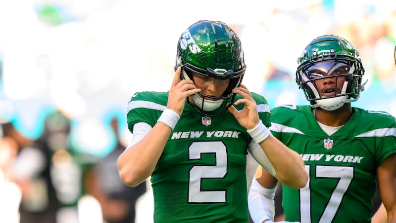 New York Jets quarterback Zach Wilson (2) looks down at the field during an NFL football game against the Miami Dolphins, Sunday, Dec 17, 2023, in Miami Gardens, Fla. Wilson has reportedly received permission to seek a trade from the team.