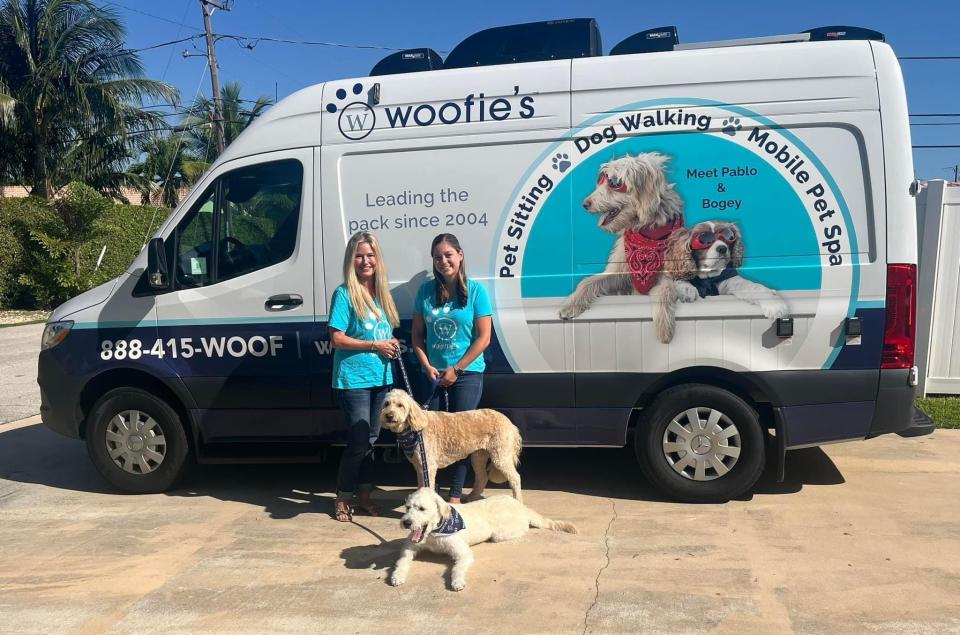 Co-owner of Woofie's Amy Addington (left) and General Manager Liz Gibbs (right) stand before the Woofie's of Delray Beach van.