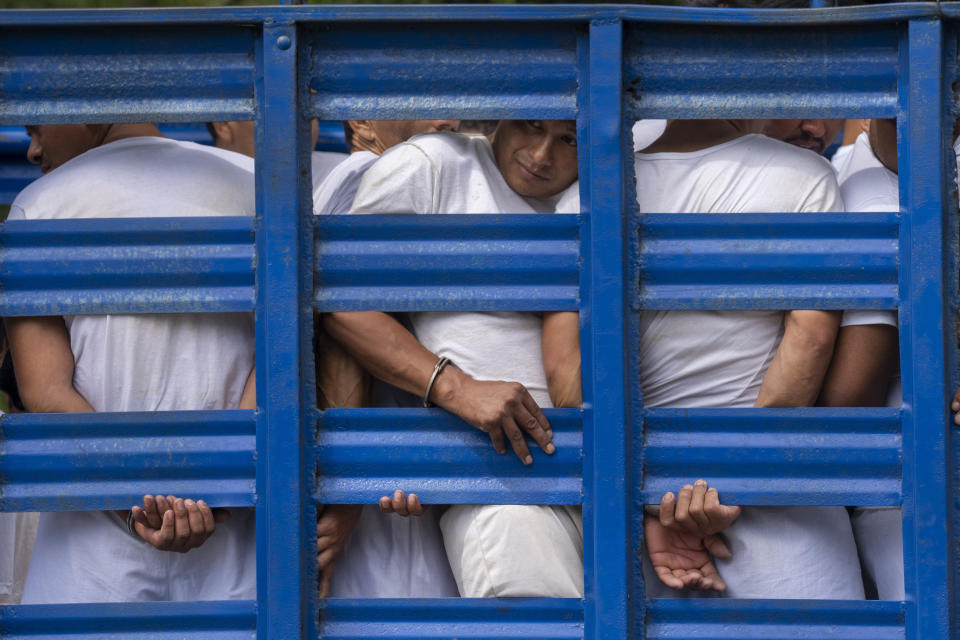 FILE - Men who were detained under the state of emergency are transported in a cargo truck, in Soyapango, El Salvador, Oct. 7, 2022. President Nayib Bukele entered an all-out war with the Barrio 18 and Mara Salvatruchas, or MS-13, gangs, suspending constitutional rights and throwing 1 in every 100 people in the country into prisons that have fueled allegations of mass human rights abuses. (AP Photo/Moises Castillo, File)