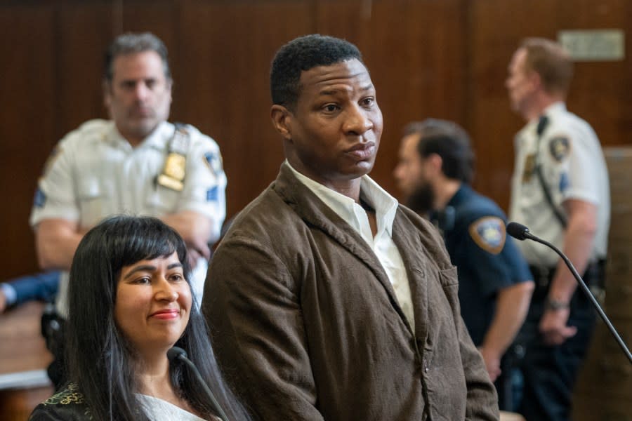 Jonathan Majors stands in court during a hearing in his domestic violence case, Tuesday, June 20, 2023 in New York. Majors’ domestic violence case will go to trial Aug. 3, the judge said Tuesday, casting him in a real-life courtroom drama as his idled Hollywood career hangs in the balance. (AP Photo/Steven Hirsch, Pool)