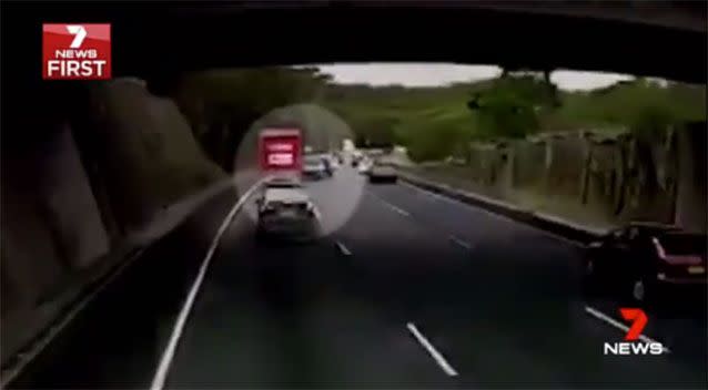 Seconds later, another ute leaves the road at the far left of the motorway colliding with a Coles truck. Source: 7 News