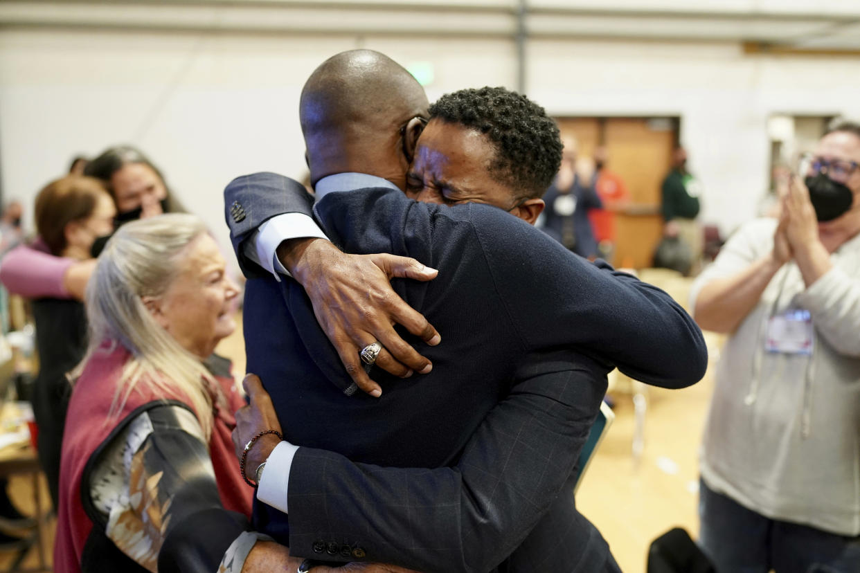 Bishop Cedrick Bridgeforth, a United Methodist elder in the California-Pacific Conference, embraces his husband, Christopher Hucks-Ortiz, after his election was announced on Nov. 4, 2022, at Christ United Methodist Church in Salt Lake City. Bridgeforth, who will lead churches in the Greater Northwest Area, said he has always worked across ideological lines in his work in church administration and would continue to do so. (Patrick Scriven/United Methodist News via AP)