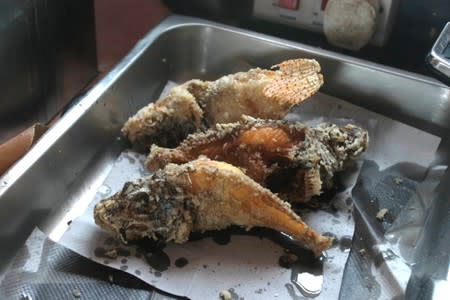 Fried lionfish is seen after a dive at the Zenobia, a cargo ship wreck off Larnaca