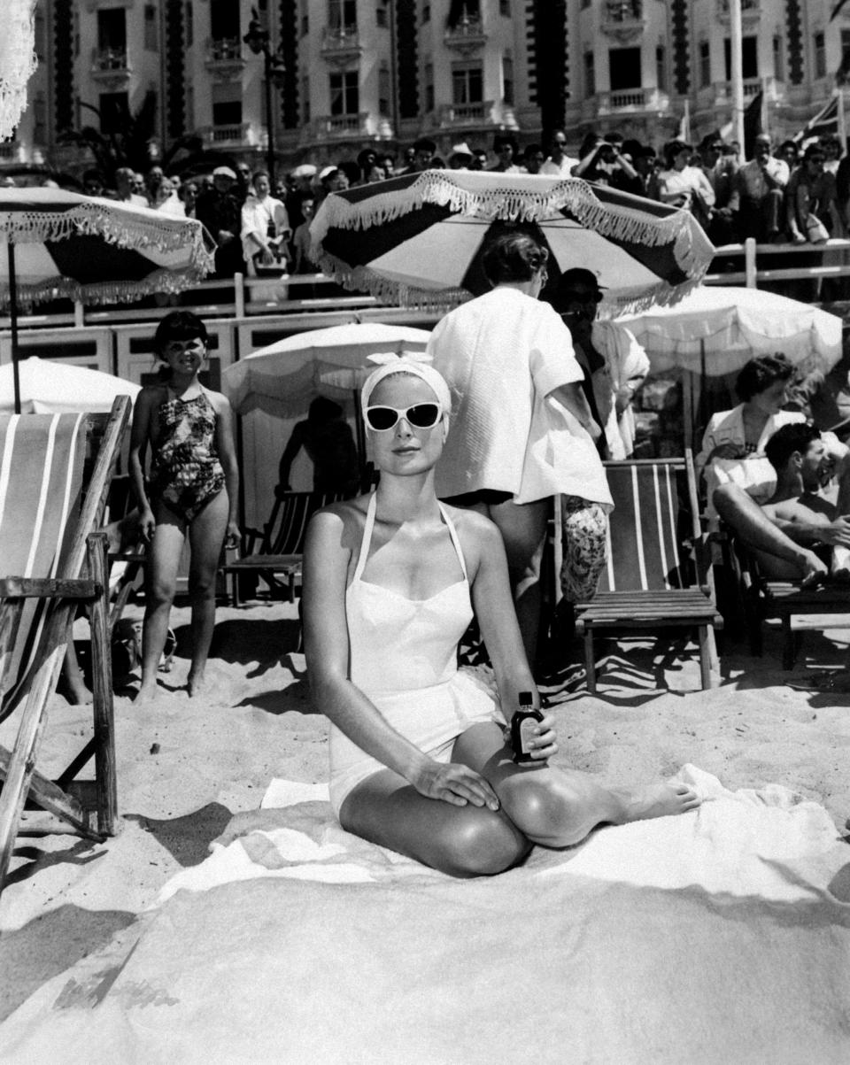 Among deckchairs and sunshades in the Cote d'Azur in 1955.