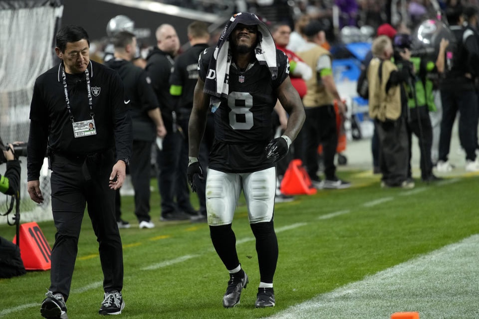 Las Vegas Raiders running back Josh Jacobs (8) leaves the game with an injury against the Minnesota Vikings during the second half of an NFL football game, Sunday, Dec. 10, 2023, in Las Vegas. (AP Photo/John Locher)