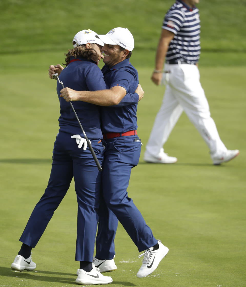 Europe's Francesco Molinari, right, and Europe's Tommy Fleetwood winning a hole in their fourball match on the opening day of the 42nd Ryder Cup at Le Golf National in Saint-Quentin-en-Yvelines, outside Paris, France, Friday, Sept. 28, 2018. (AP Photo/Matt Dunham)