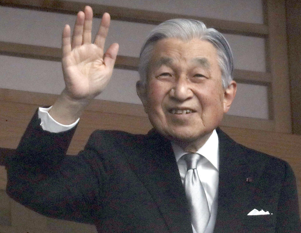 Japan's Emperor Akihito waves to well-wishers as they appear on the balcony of the Imperial Palace to mark the emperor's 85th birthday in Tokyo Sunday, Dec. 23, 2018. Emperor Akihito, marking his birthday — his last before his upcoming abdication — said he feels relieved that his reign is coming to an end without having seen his country at war and that it is important to keep telling younger people about his nation's wartime history.(AP Photo/Eugene Hoshiko)