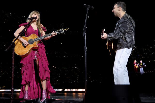 <p>Kevin Mazur/TAS23/Getty </p> Taylor Swift and Jack Antonoff perform together during the Eras Tour.