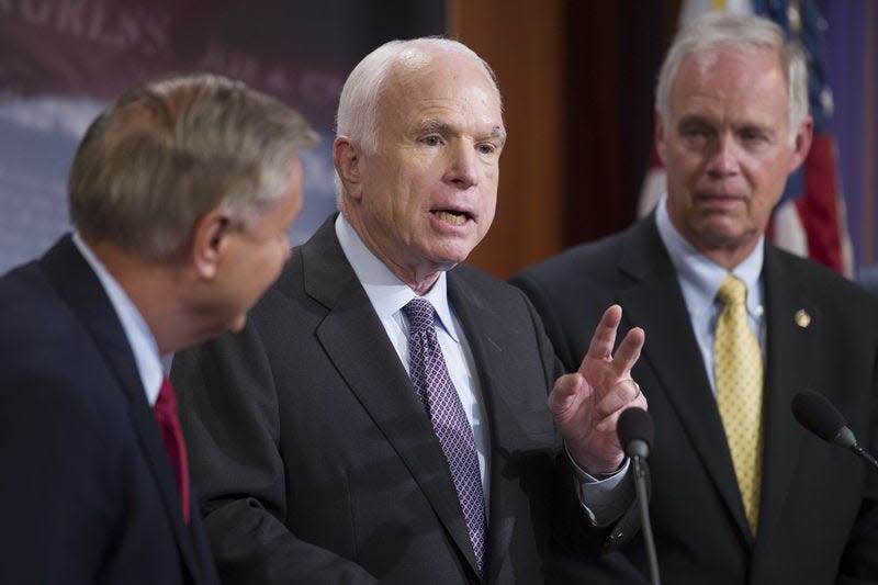 In this 2017 photo, U.S. Sens. Lindsey Graham, R-S.C., John McCain, R-Ariz., and Ron Johnson, R-Wis., speak after the Republican-controlled U.S. Senate failed to deliver on a political promise to repeal and replace "Obamacare" because of opposition and wavering within the GOP ranks.