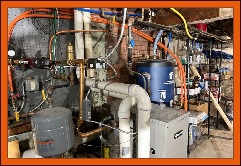 Our basement, with a boiler and old water heater - Photo: Tik Root/Grist