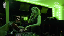 In this March 18, 2020, frame from video provided by Rundfunk Berlin-Brandenburg, DJ Monika Kruse performs a set as part of the “United We Stream” event at the club Watergate in Berlin. Berlin's nightclubs were closed March 13 to help slow the spread of the virus. In response, some of them formed a streaming platform to let DJs, musicians and artists continue performing. (Rundfunk Berlin-Brandenburg via AP)