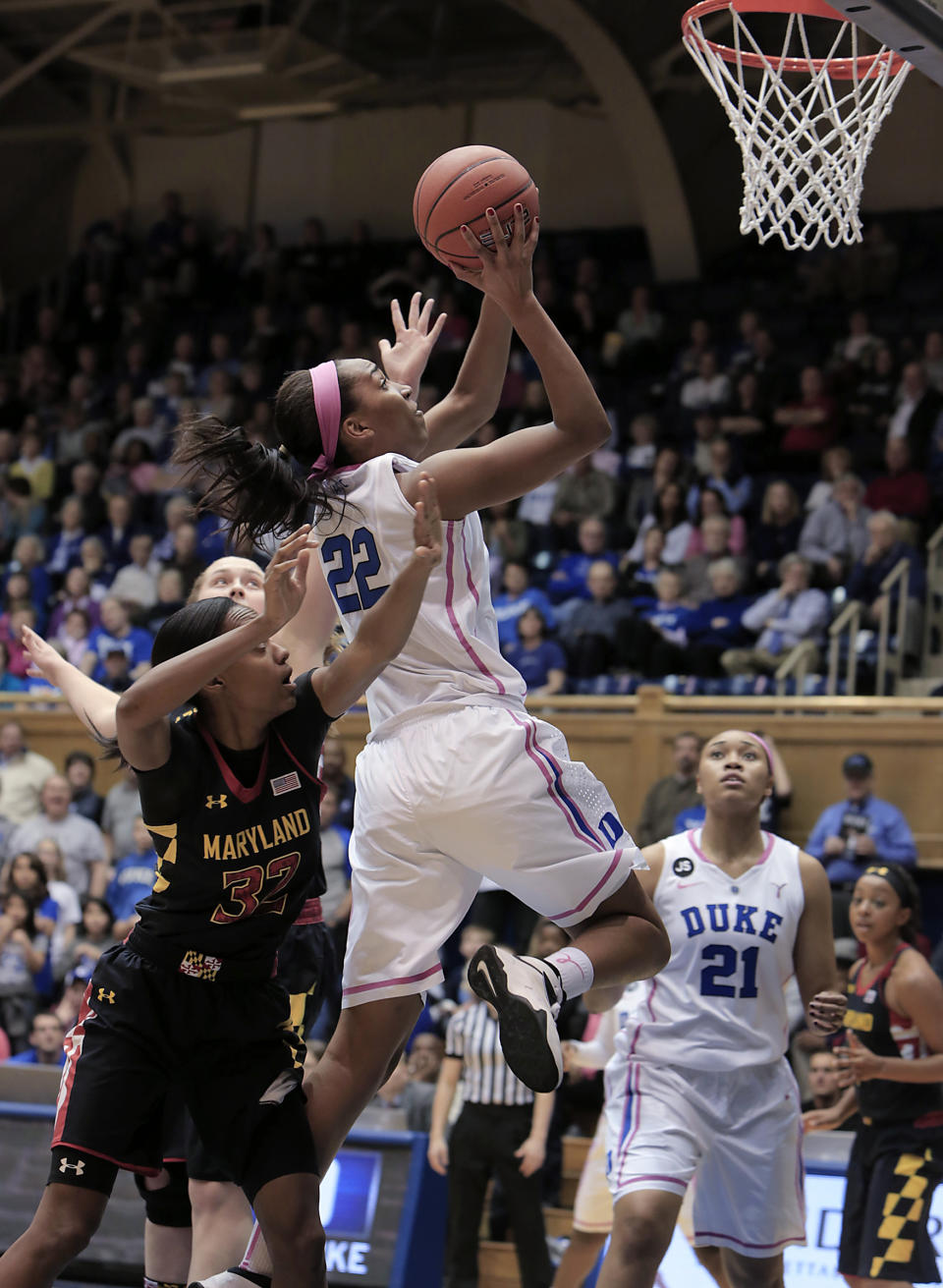Duke's Oderah Chidom (22) drives to the basket ahead of Maryland's Shatori Walker-Kimbrough (32) during the first half of an NCAA college basketball game in Durham, N.C., Monday, Feb. 17, 2014. (AP Photo/Ted Richardson)
