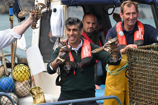 Rishi Sunak on board a fishing boat with fishermen