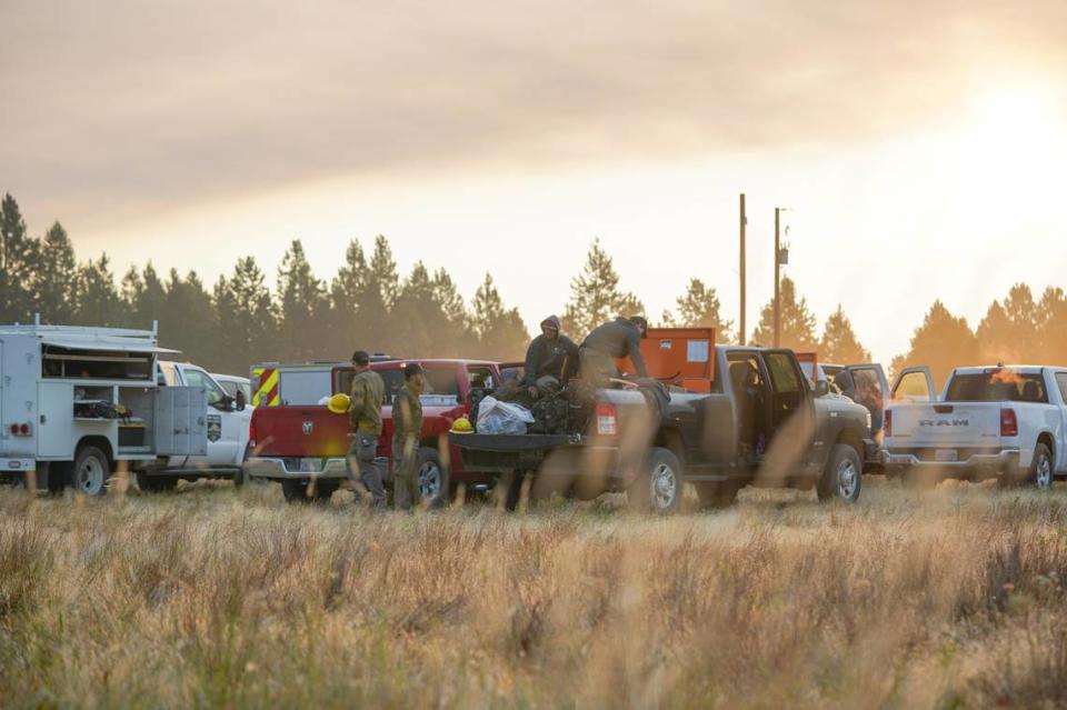 Wildland firefighters prepare their gear and trucks before heading to the fireline on the Battle Mountain Complex, which includes the Monkey Creek Fire, outside of Ukiah, Oregon.