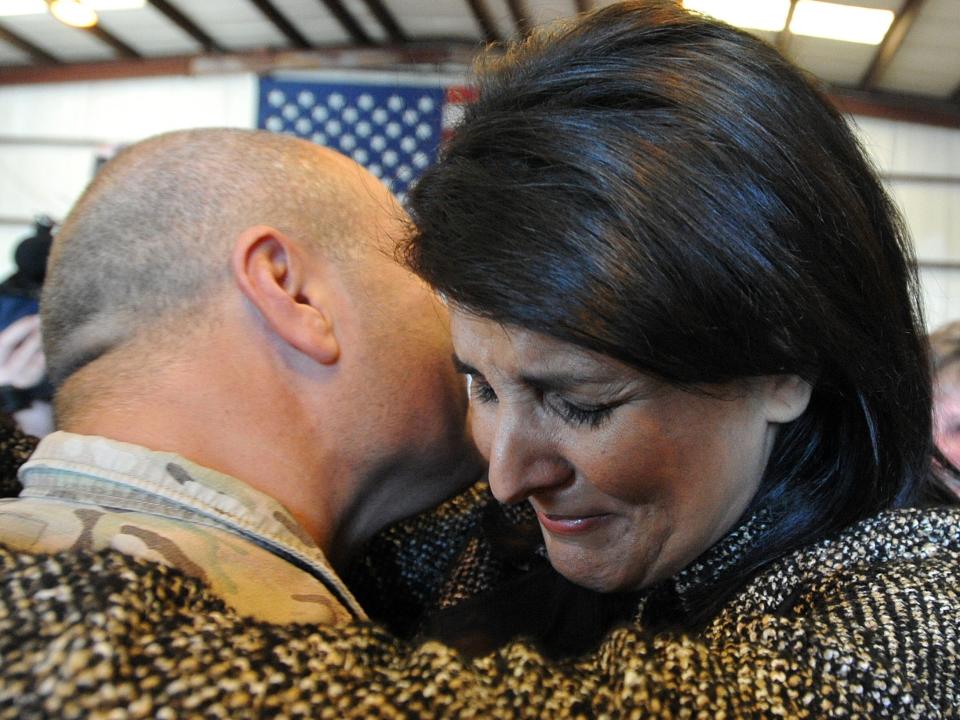 Nikki Haley cries as she hugs her husband Michael Haley after his return from Afghanistan