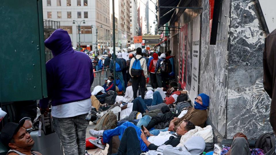 PHOTO: Hundreds of migrants are seen outside the Roosevelt Hotel in Midtown Manhattan early Aug. 2, 2023 in New York. (Luiz C. Ribeiro for NY Daily News via Getty Images)