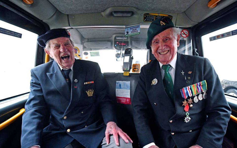 World War II veterans Roy Maxwell (left) and Alf Lonsdale sit in the back of a black cab at Wellington Barracks, London, ahead of their veterans trip to northern France with the Taxi Charity. PRESS ASSOCIATION Photo. Picture date: Sunday February 12, 2017. World War II veterans will be taken on a final trip back to the beaches of northern France by the Taxi Charity for Military Veterans, and are joined by Guardsmen inside the Wellington Barracks. Photo credit should read: Victoria Jones/PA Wire - PA/PA