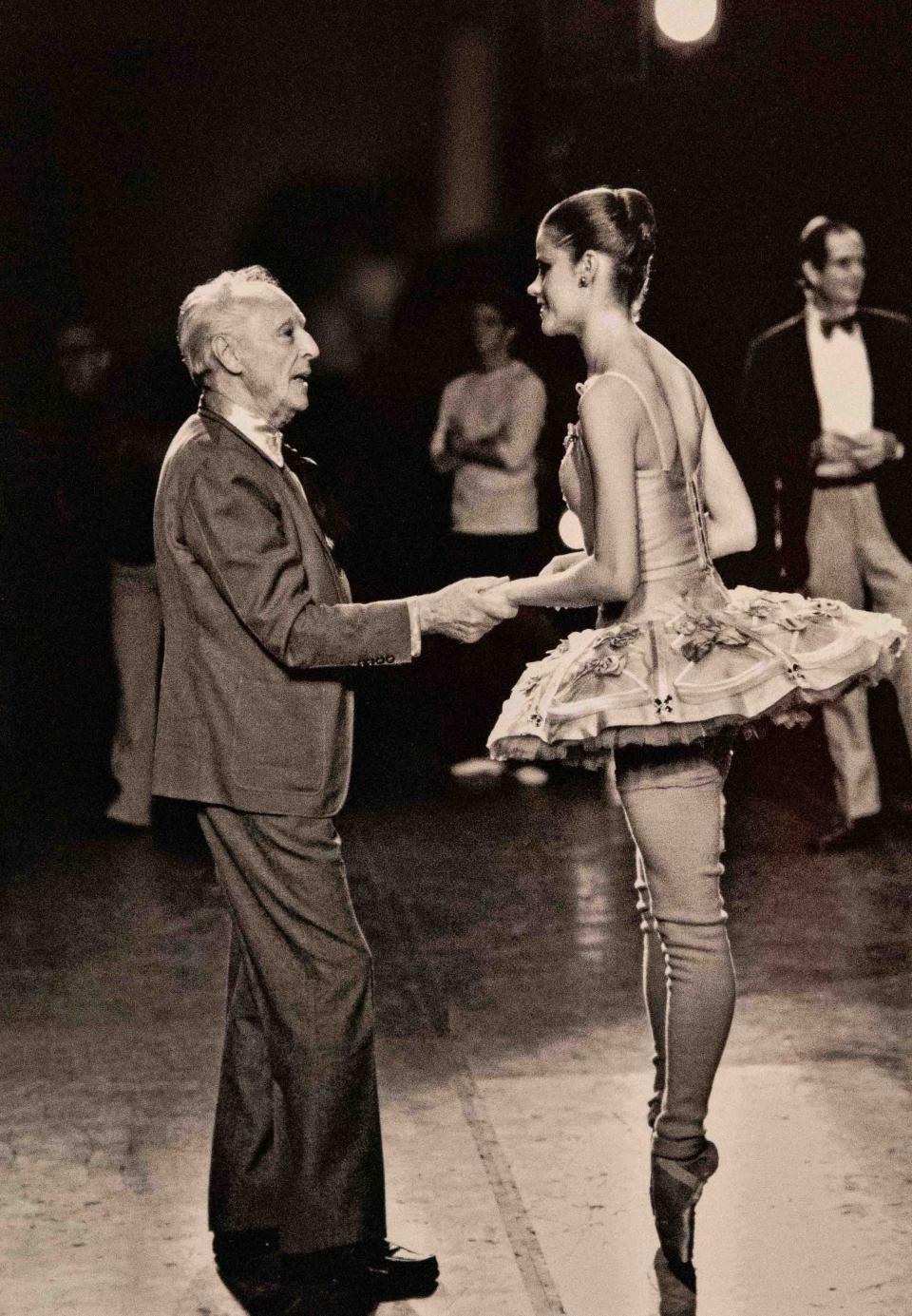 Legendary chorographer George Balanchine talks to ballerina Merrill Ashley before a performance at New York City Ballet in 1980. This photo by Steven Caras is among many in the "Carasmatic" exhibit at the Kravis Center.