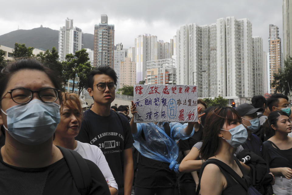 Protesters gather outside the Eastern Court in Hong Kong, Wednesday, July 31, 2019. Supporters rallied outside a court in Hong Kong on Wednesday ahead of a court appearance by more than 40 fellow protesters who have been charged with rioting. (AP Photo/Vincent Yu)