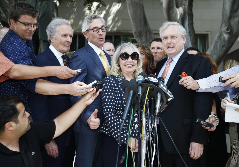 Shelly Sterling, 79, (2nd R) speaks at a news conference with her lawyer Pierce O'Donnell (R) and Steve Ballmer's lawyer Adam Streisand (3rd R) in Los Angeles, California July 28, 2014. The record $2 billion sale of pro basketball's Los Angeles Clippers to former Microsoft Corp chief executive Steve Ballmer can proceed over the objections of co-owner Donald Sterling, a judge tentatively ruled on Monday. Los Angeles Superior Court Judge Michael Levanas said the deal, brokered by Sterling's estranged wife, Shelly Sterling, was permissible and could be consummated even if Sterling, who has been banned for life from the NBA for racist remarks, chose to appeal. REUTERS/Lucy Nicholson (UNITED STATES - Tags: CRIME LAW SPORT BASKETBALL)