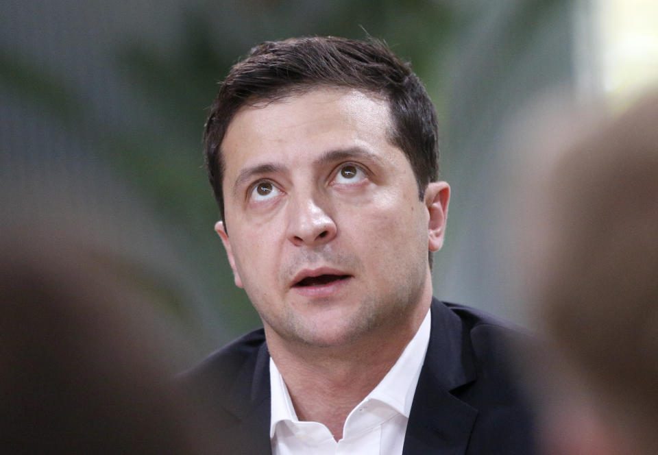 Ukrainian President Volodymyr Zelenskiy speaks during talks with journalists in Kyiv, Ukraine, Thursday, Oct. 10, 2019. Ukrainian President is holding an all-day "media marathon" in a Kyiv food court amid growing questions about his actions as president. (AP Photo/Efrem Lukatsky)