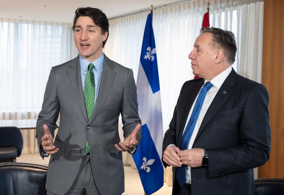 Prime Minister Justin Trudeau, left, attended a bilateral meeting with Quebec Premier François Legault in Montreal on Friday. (Christinne Muschi/The Canadian Press - image credit)