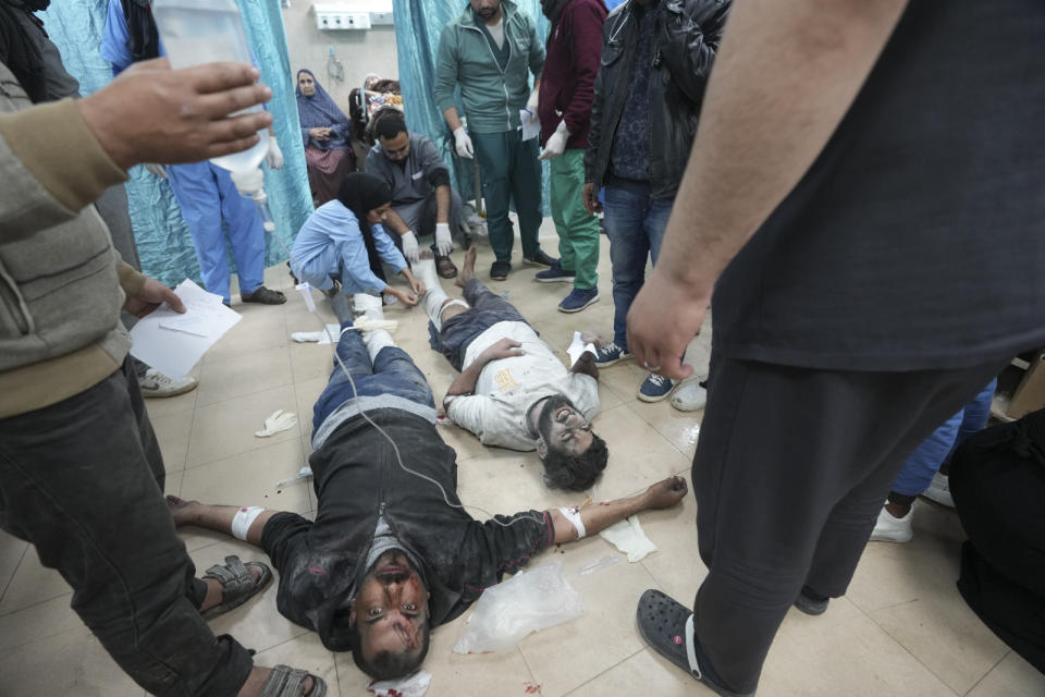 Palestinians wounded in the Israeli bombardment of the Gaza Strip are treated in a hospital in Deir al Balah on Sunday, Feb. 4, 2024. (AP Photo/Adel Hana)