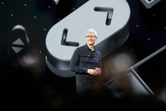 Apple CEO Tim Cook speaking onstage at WWDC 2018.