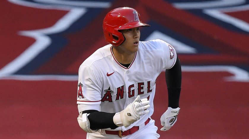 Los Angeles Angels' Shohei Ohtani, of Japan, runs to first as he pops out during the first inning of a baseball game against the Seattle Mariners Wednesday, July 29, 2020, in Anaheim, Calif. (AP Photo/Mark J. Terrill)