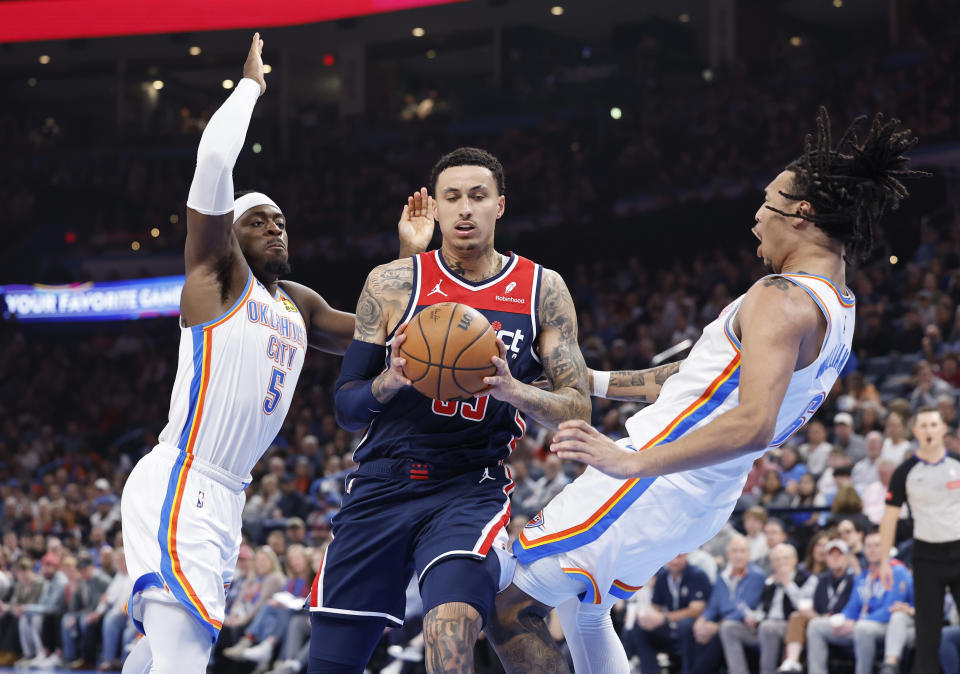 Feb 23, 2024; Oklahoma City, Oklahoma, USA; Washington Wizards forward Kyle Kuzma (33) runs into Oklahoma City Thunder forward <a class="link " href="https://sports.yahoo.com/nba/players/6724/" data-i13n="sec:content-canvas;subsec:anchor_text;elm:context_link" data-ylk="slk:Jaylin Williams;sec:content-canvas;subsec:anchor_text;elm:context_link;itc:0">Jaylin Williams</a> (6) and gets an offensive foul on a drive during the second quarter at Paycom Center. Mandatory Credit: Alonzo Adams-USA TODAY Sports