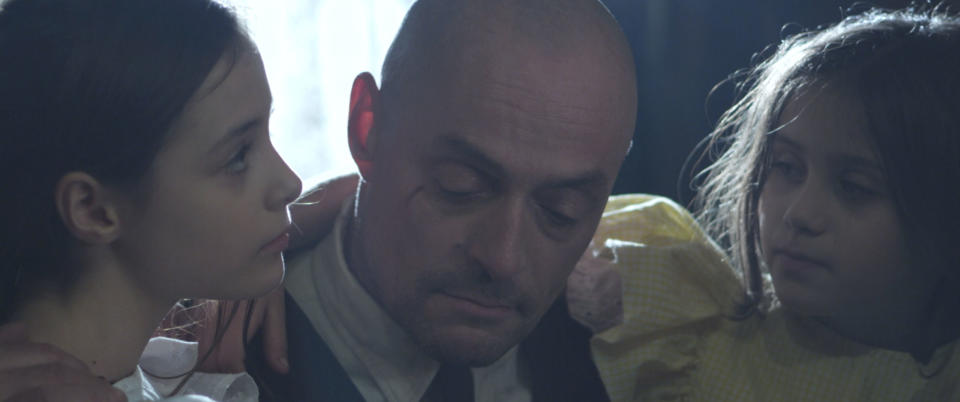 Sean Cronin and his daughters in a still from <i>Eleven</i> (Evolutionary Films)