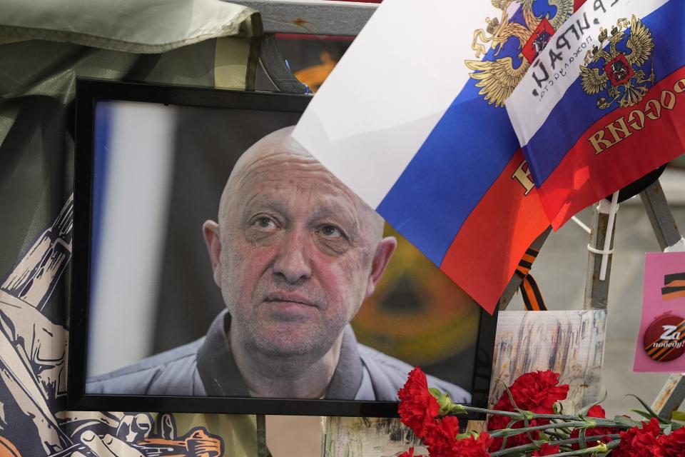 FILE - A portrait of the owner of mercenary chief Yevgeny Prigozhin decorates an informal street memorial near the Kremlin in Moscow, Russia, on Saturday, Aug. 26, 2023. Prigozhin and his top lieutenants were among the 10 people killed in a private plane crash on Aug. 23 while flying from Moscow for St. Petersburg. (AP Photo/Alexander Zemlianichenko, File)