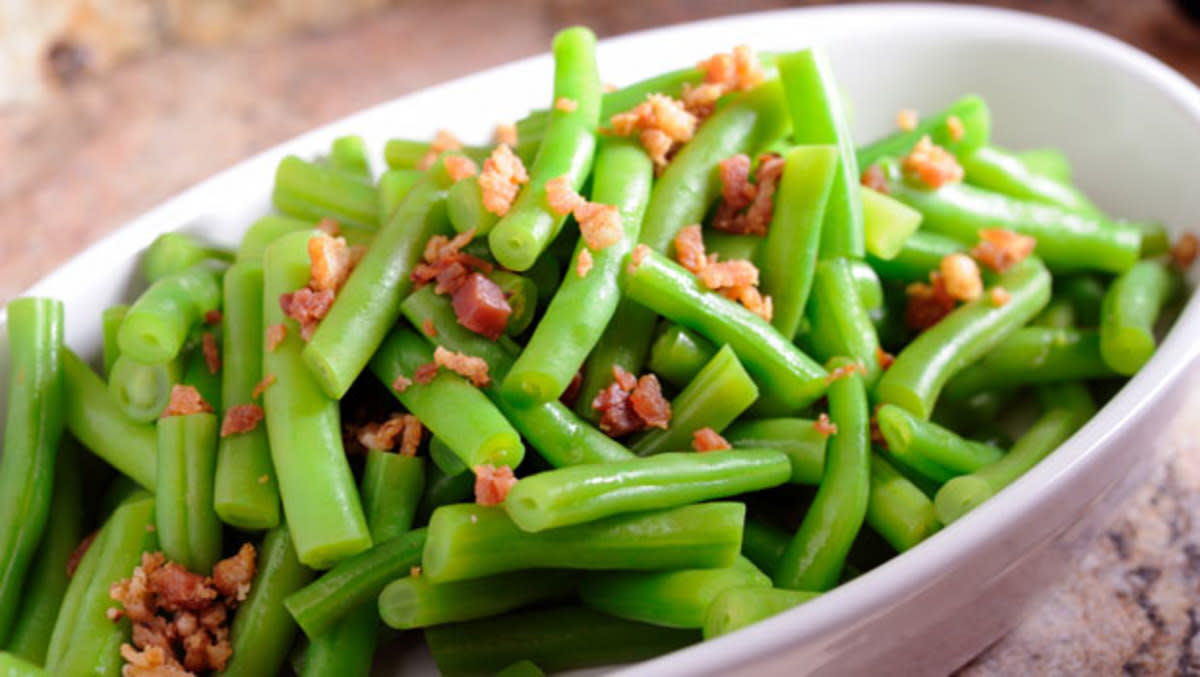 <p>Parade</p><p>Bacon bits liven up this simple veggie side dish.</p><p><strong>Get the Recipe: <a href="/29115/dash/green-beans-and-bacon/" data-ylk="slk:Green Beans and Bacon;elm:context_link;itc:0;sec:content-canvas" class="link rapid-noclick-resp">Green Beans and Bacon</a></strong></p>