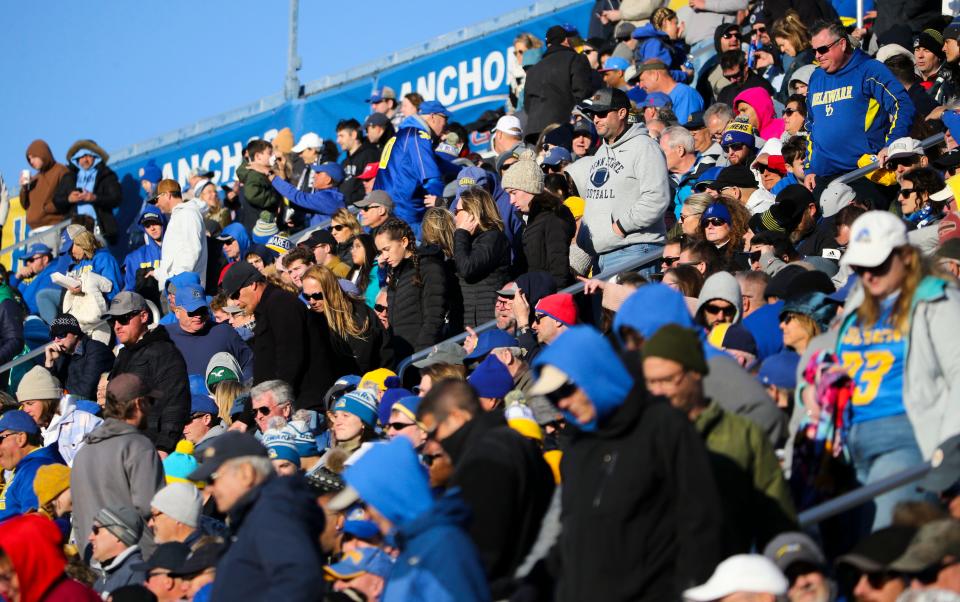 Fans head for the exits as the Wildcats take a 28-7 lead late in the third quarter of the Blue Hens' 35-7 loss at Delaware Stadium, Saturday, Nov. 18, 2023.