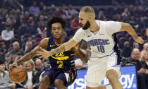Cleveland Cavaliers' Collin Sexton (2) drives past Orlando Magic's Evan Fournier (10) in the first half of an NBA basketball game, Friday, Dec. 6, 2019, in Cleveland. (AP Photo/Tony Dejak)
