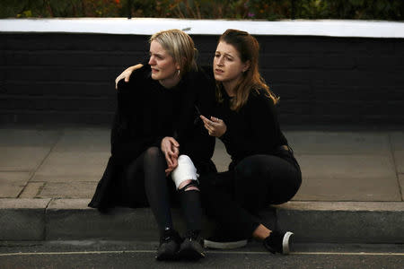 An injured woman reacts outside Parsons Green tube station in London, Britain September 15, 2017. REUTERS/Kevin Coombs