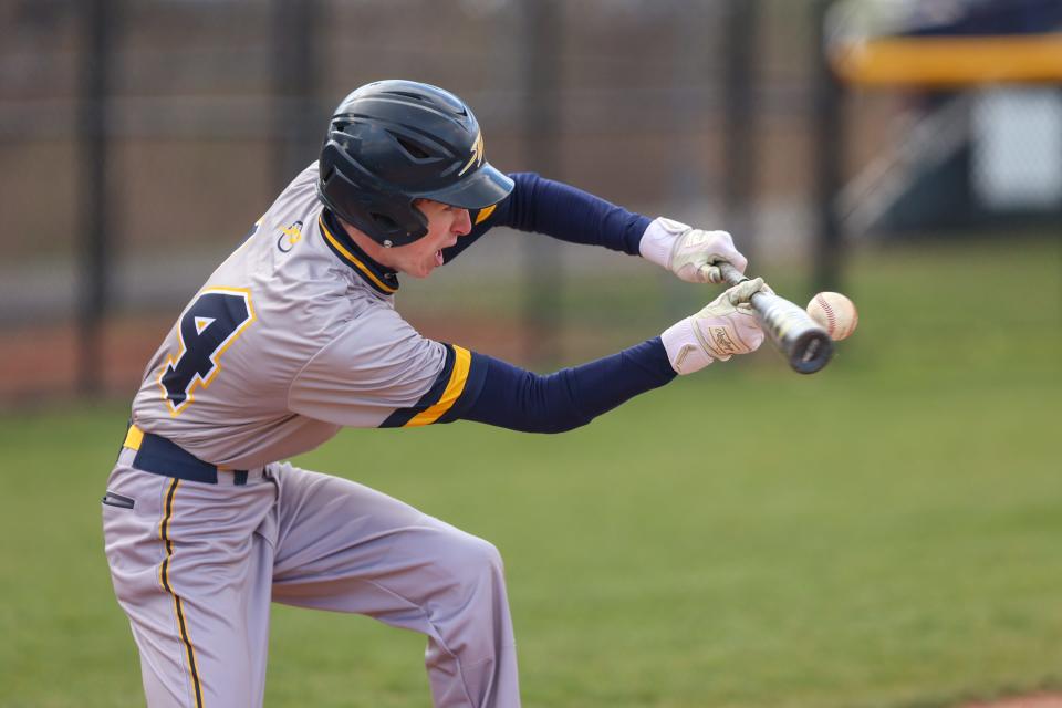 Streetsboro’s Jack Pincoe connects on a bunt against Field last year.