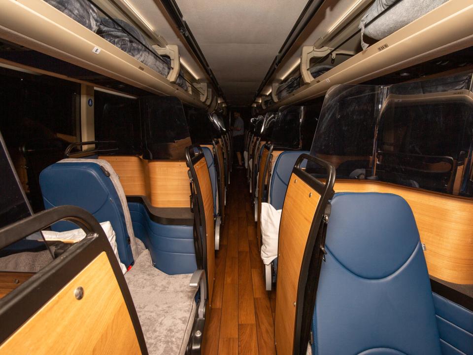 Rows of bus seats separated by boards.